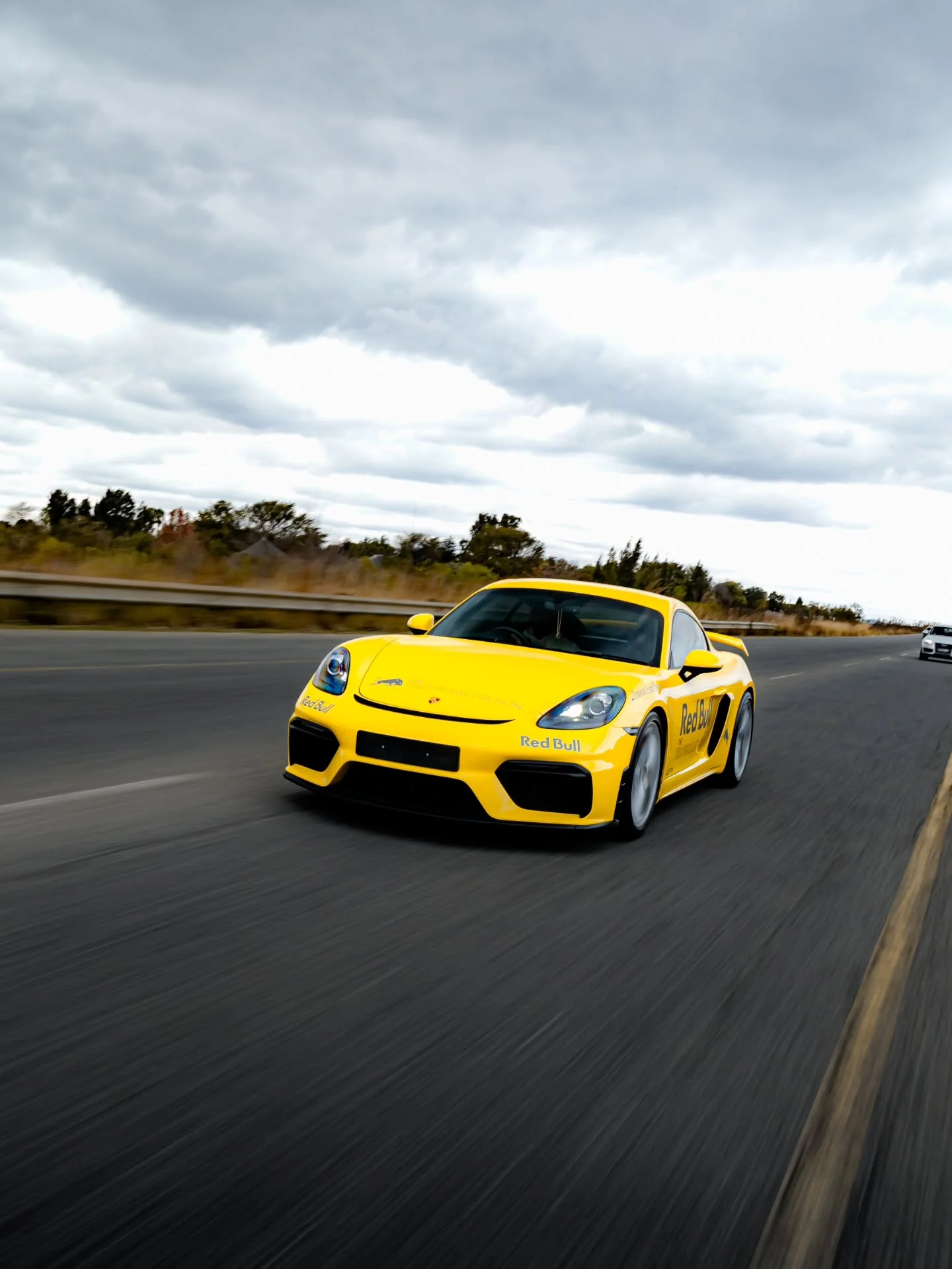 Yellow performance car out on the road